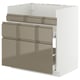 Modern kitchen unit, white with bronze drawers, metallic handles, sleek design.