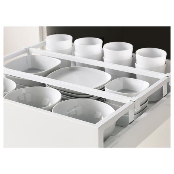 Open drawer with white dishes and bowls; slow-close mechanism.