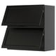 Black kitchen cabinets, two square doors with beveled edges.