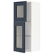 Blue ikea METOD wall cabinet with glass shelves.