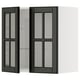 Dark glass-fronted cabinet, white sides, three shelves visible, sleek modern design.
