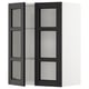 METOD kitchen cabinet with black stained glass doors and beveled edges.