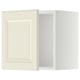 An off-white METOD kitchen wall cabinet with a traditional design and bevelled edges.