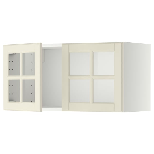 Two off-white METOD kitchen wall cabinets with glass doors and bevelled edges.