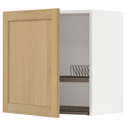 An open wooden kitchen cabinet with a metal dish rack.