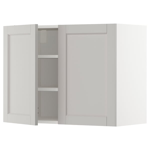White METOD kitchen cabinet with beveled edges and inner shelves.