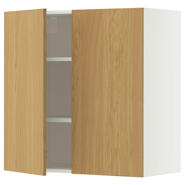 A light wood-colored wall cabinet with a single open door. The cabinet sleek, modern lines and adjustable shelves.