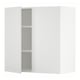 A white METOD wall cabinet with one door open, revealing adjustable shelves.
