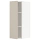 Beige kitchen cabinets: METOD kitchen system. Tall, white, smooth, modern with two shelves.