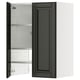 A black METOD kitchen cabinet with a beveled edge, open to display its adjustable shelves.