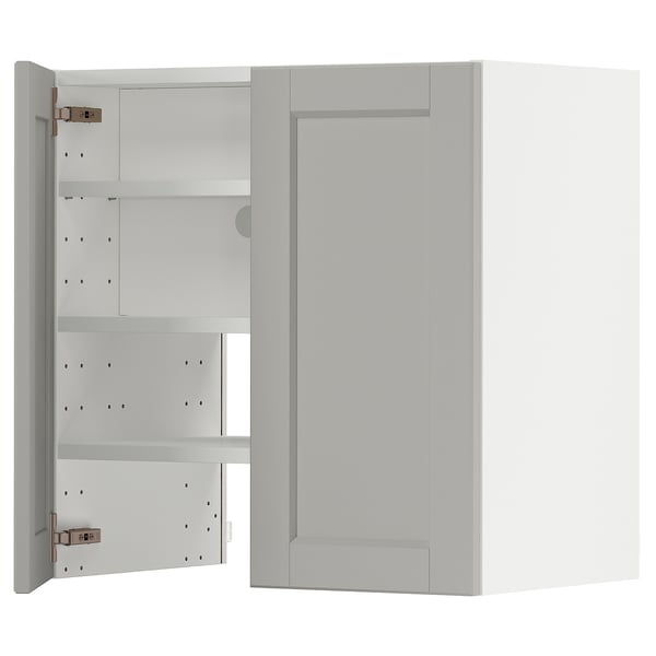 A light grey METOD kitchen cabinet with beveled edges, featuring adjustable shelves and snap-on hinges.