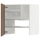 White METOD kitchen unit with one open wooden door, showcasing adjustable shelves inside.