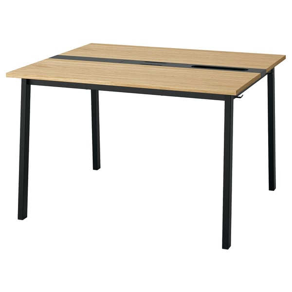 A MITTZON conference table with a light oak top and black metal legs, featuring built-in cable management.