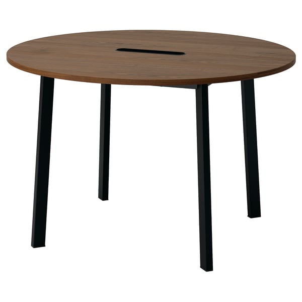 A round wooden conference table named MITTZON with black metal legs, designed for small group meetings in office or lobby spaces.