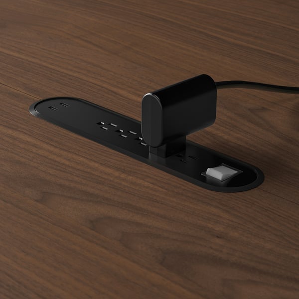 Built-in power module with multiple usb ports and cable management tray for charging devices.