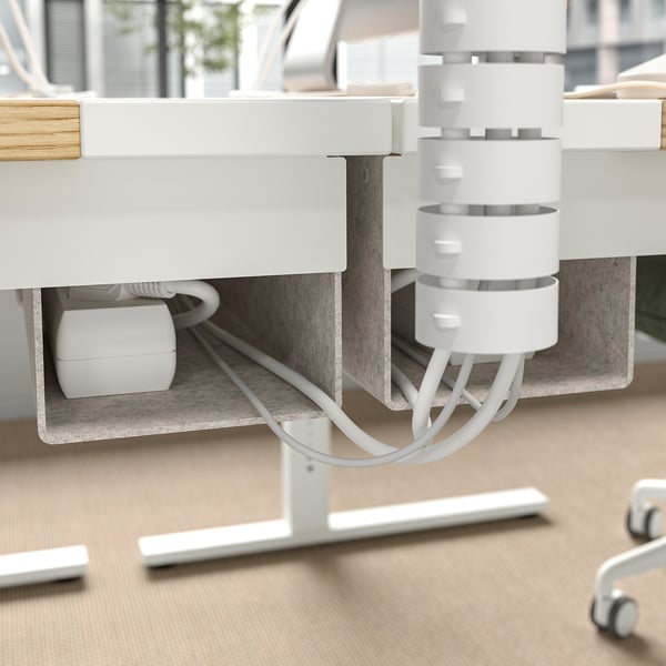Desk with cable management tray under table for organised workspace.
