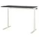 A MITTZON sit/stand desk in black and white. It a smooth, rectangular tabletop with adjustable legs, supporting a modern and minimalist design.
