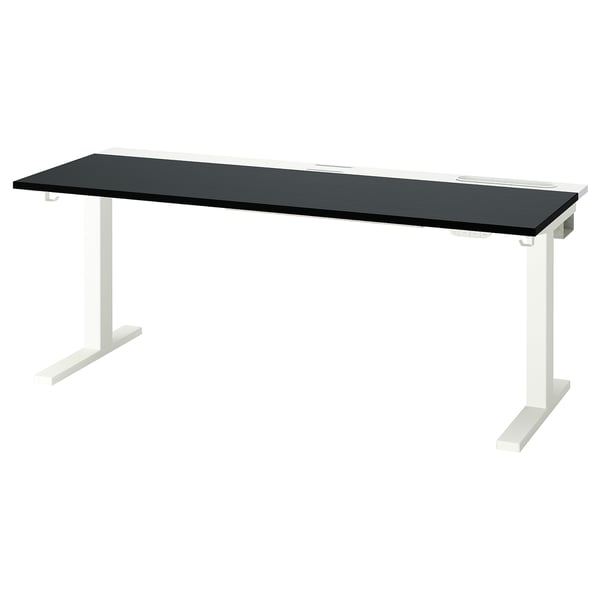 Modern MITTZON sit/stand desk. Black top, white legs. Ergonomic design. Dual motors for height adjustment.