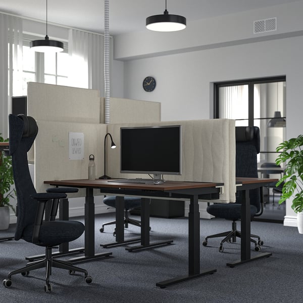 Modern office space with MITTZON sit-stand desks, ergonomic chairs, sleek lighting, and acoustic screens.