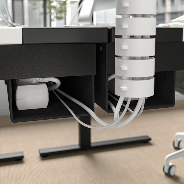 MITTZON height-adjustable desk with built-in cable management tray and side hooks for organisation.
