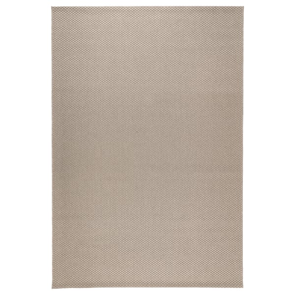 A rectangular MORUM rug in a neutral colour, made of polypropylene with a woven texture.