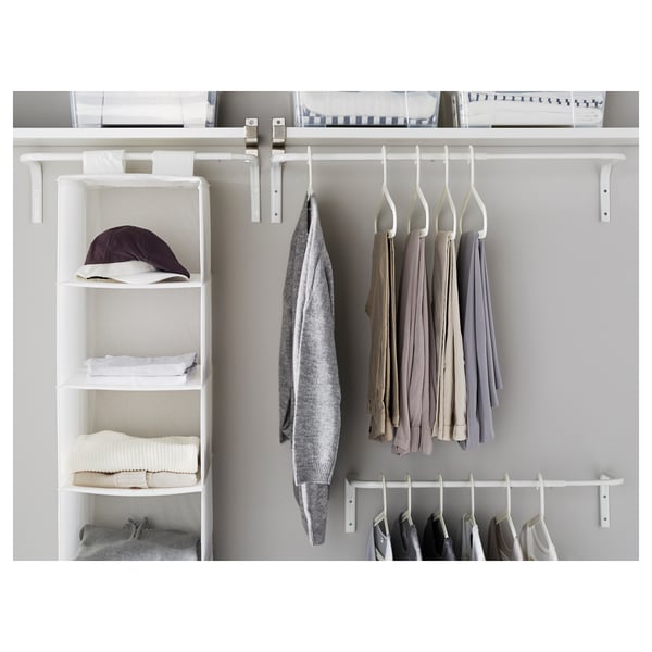 Closet with adjustable white hanging rods displaying neatly organised clothes on hangers and shelves.