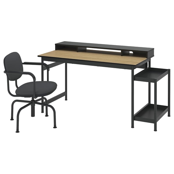 Home office setup: MULLSJÖ desk and black chair. Desk is wooden with metal frame. Chair has armrests and a swivel base.