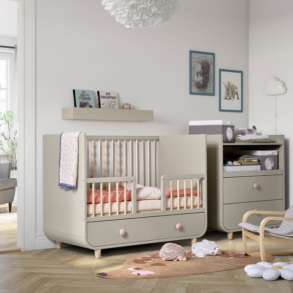 Millra nursery: grey cot, dresser, shelves, cloud light.