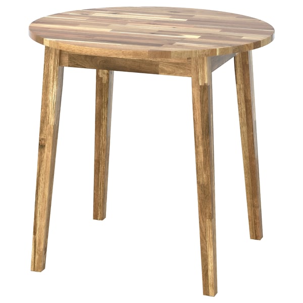 Depicts a NACKANÄS round wooden table with light brown acacia wood and simple shaker-style design.