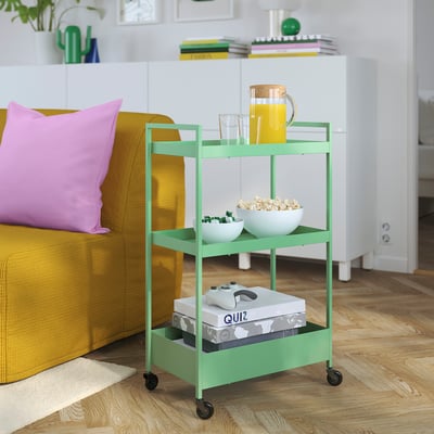 This image shows a green, three-tiered metal rolling trolley. It has a rectangular shape and is designed for storage and easy movement.