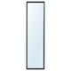 A tall NISSEDAL mirror, modern black frame, hangs vertically or horizontally, safe for bathrooms.