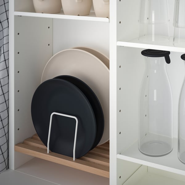 Kitchen cabinet with storage: dish organisers and containers. 94 characters