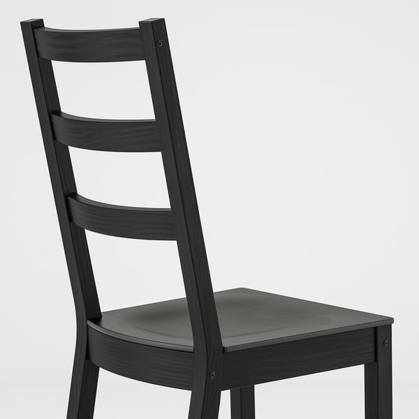Black wooden chair with high backrest, ladder-back design, sturdy construction.