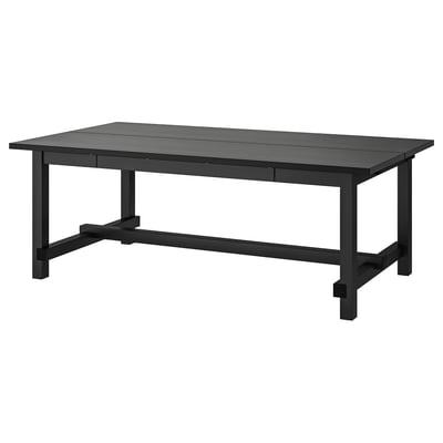 Black NORDVIKEN extendable dining table with wood, sturdy legs, and built-in extensions for modern interiors.