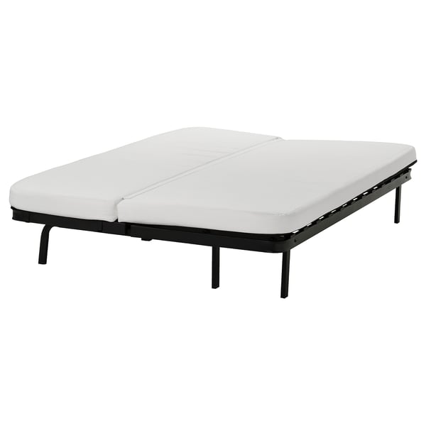 A white NYHAMN foam mattress with a black metal frame, designed for a sofa-bed, featuring a removable cover for machine washing.
