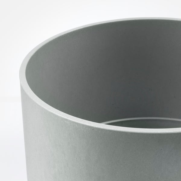 Modern, matte grey cylindrical planter, smooth texture, minimalist design.