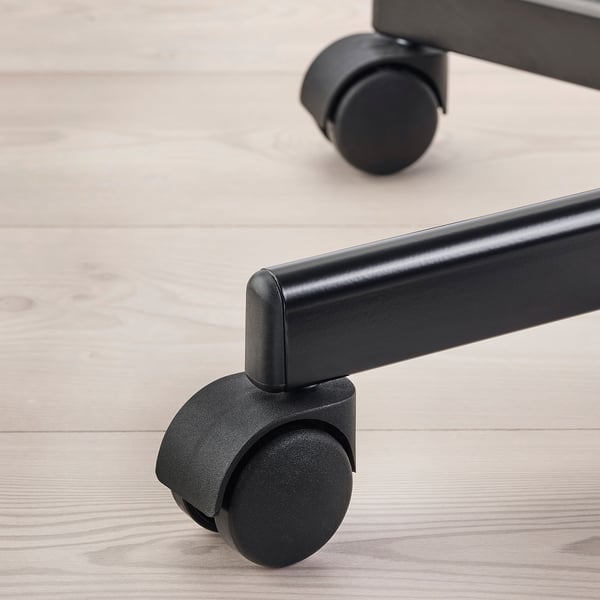 Close-up of a swivel chairs castor, showing quality materials and design.