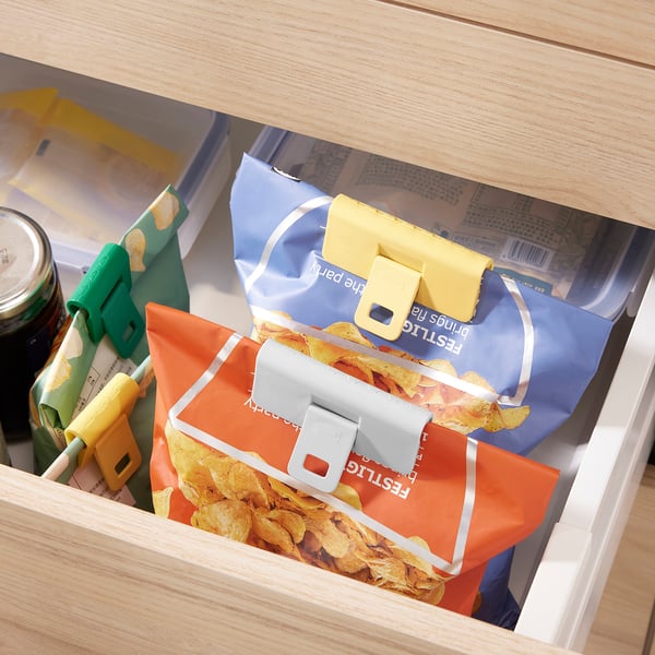 Colourful bag seals in drawer, keeping snacks fresh and organised.