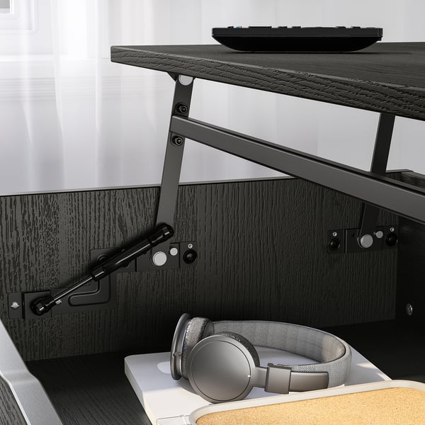 Black adjustable coffee table with two heights, hidden storage, and cable management below.