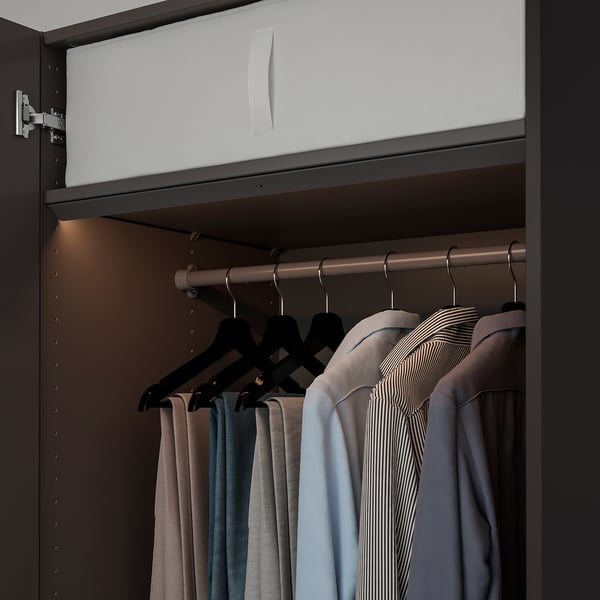 Modern closet with led light that illuminates when door opens, brightening clothes.