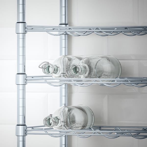 Shelves holding glass jars and containers, part of an adjustable storage system.