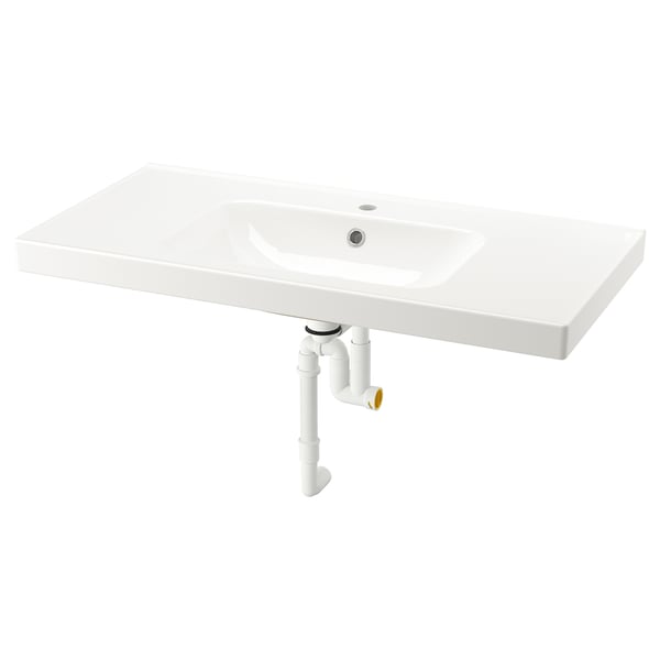 White ORRSJÖN ceramic sink with soft curved lines and integrated drain.