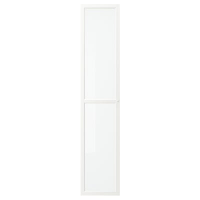 A white OXBERG glass door. Its rectangular with a fiberboard frame and tempered glass panel.