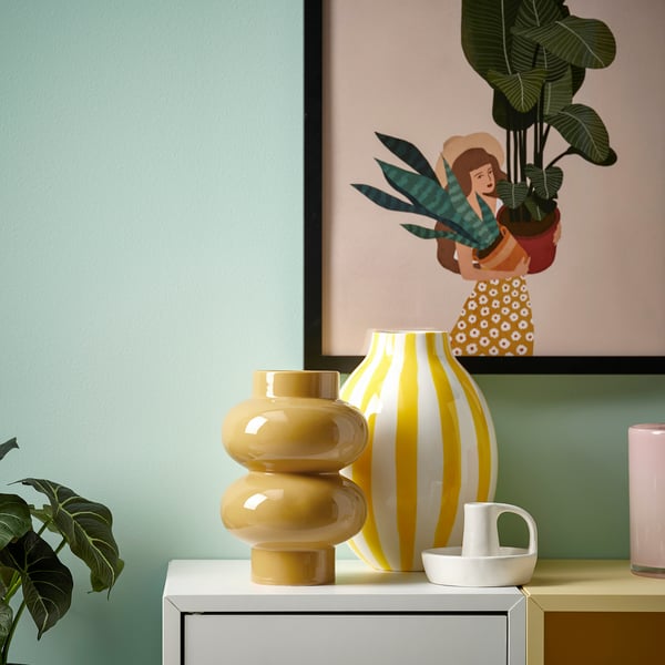 Three modern vases: yellow, striped, handled white. Glossy finish.