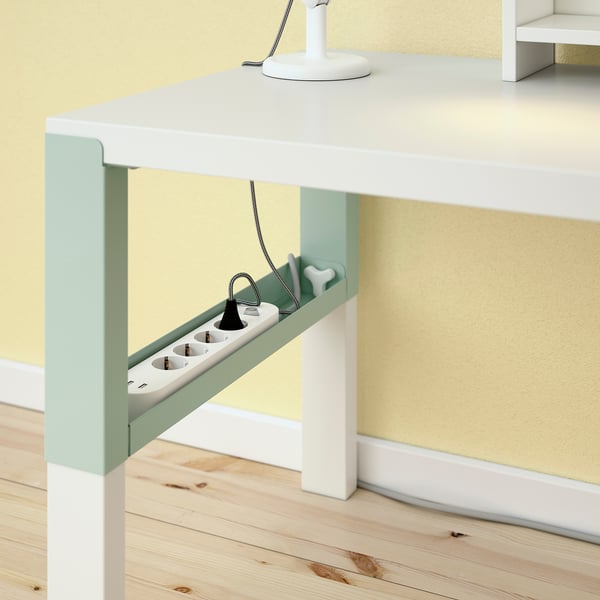 Desk with adjustable height and cable management trays.