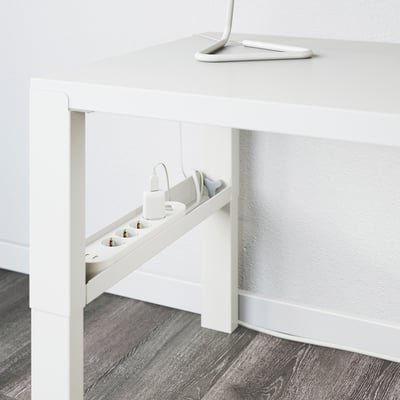 White desk with adjustable height, cable management trays, and shelf.