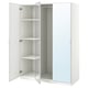 A white ikea PAX wardrobe with mirrored doors. It has multiple shelves inside.