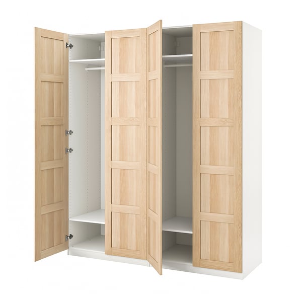 PAX wardrobe in white and light wood. Open doors show shelves and hanging rail.