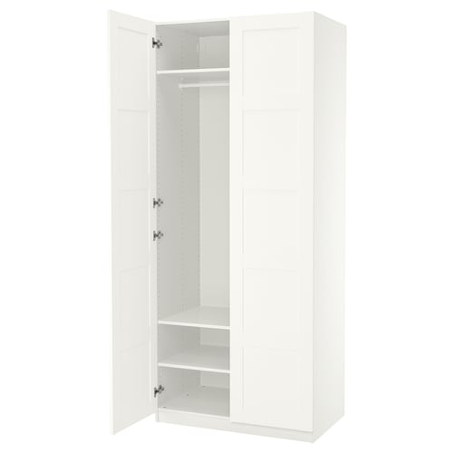 White PAX wardrobe, tall, rectangular with one open door revealing shelves and hanging rod.