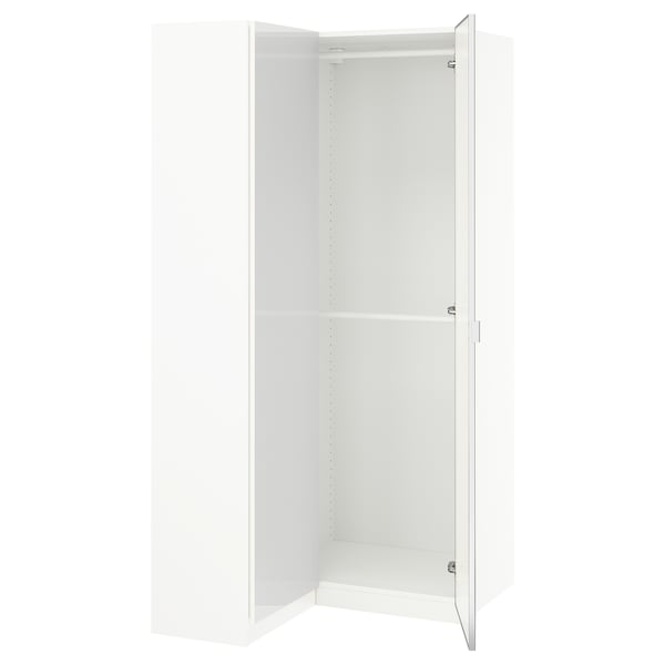 A white PAX wardrobe with mirrored doors and shelving, offering ample storage space.